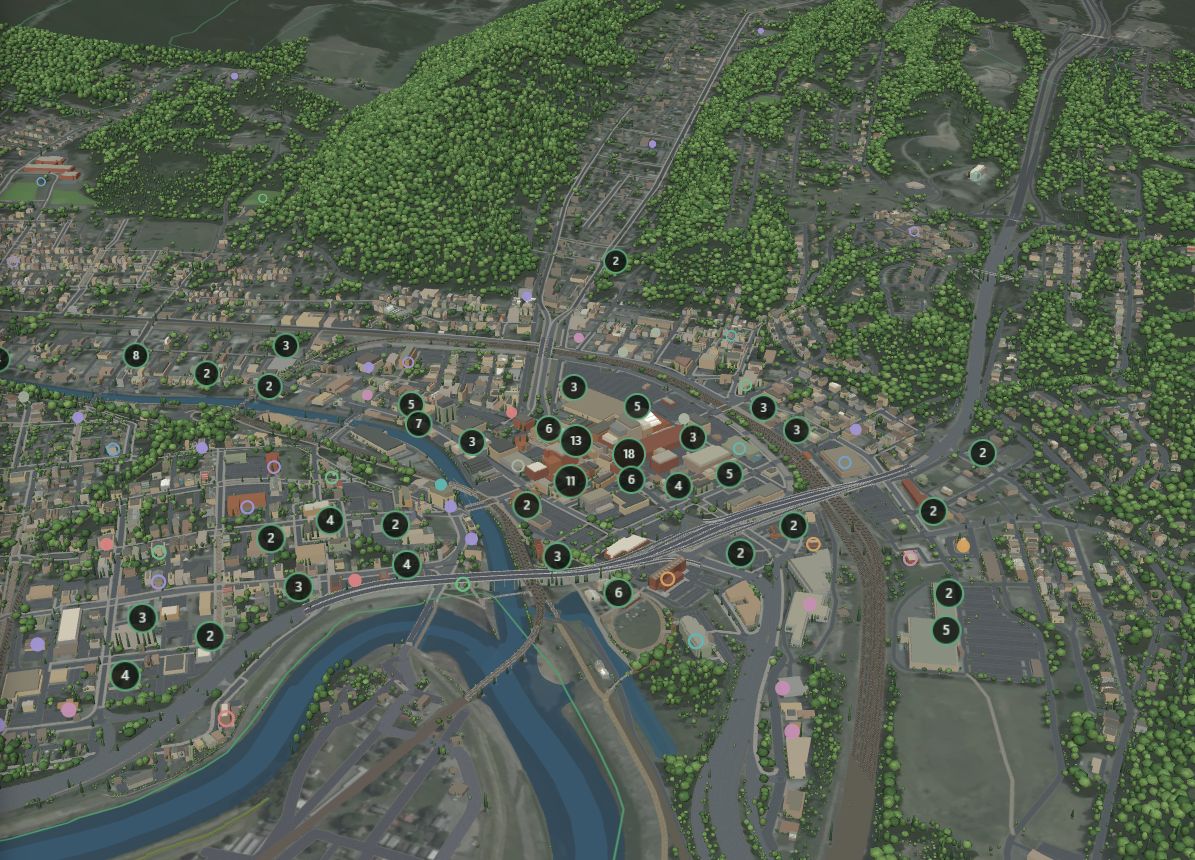 3D view of Cumberland with the Potomac River, downtown buildings, wooded hills and numbered place markers